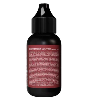 A small black bottle with a pointed black cap, showing the back side with a dark red label containing white text, isolated on a white background.