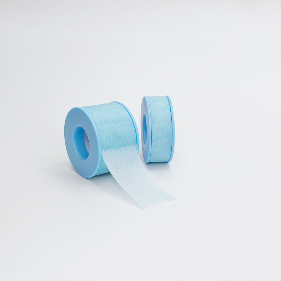 A roll of blue anti-allergy tape used for eyelash extension to hold up eyelid or hold down bottom lashes