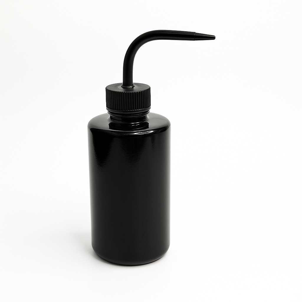 Black plastic squeeze bottle with a long spout for washing eyes and eyelashes